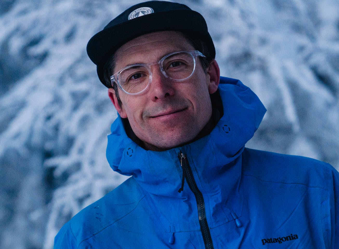 Man in blue snow jacket and Oslo Eyeglasses