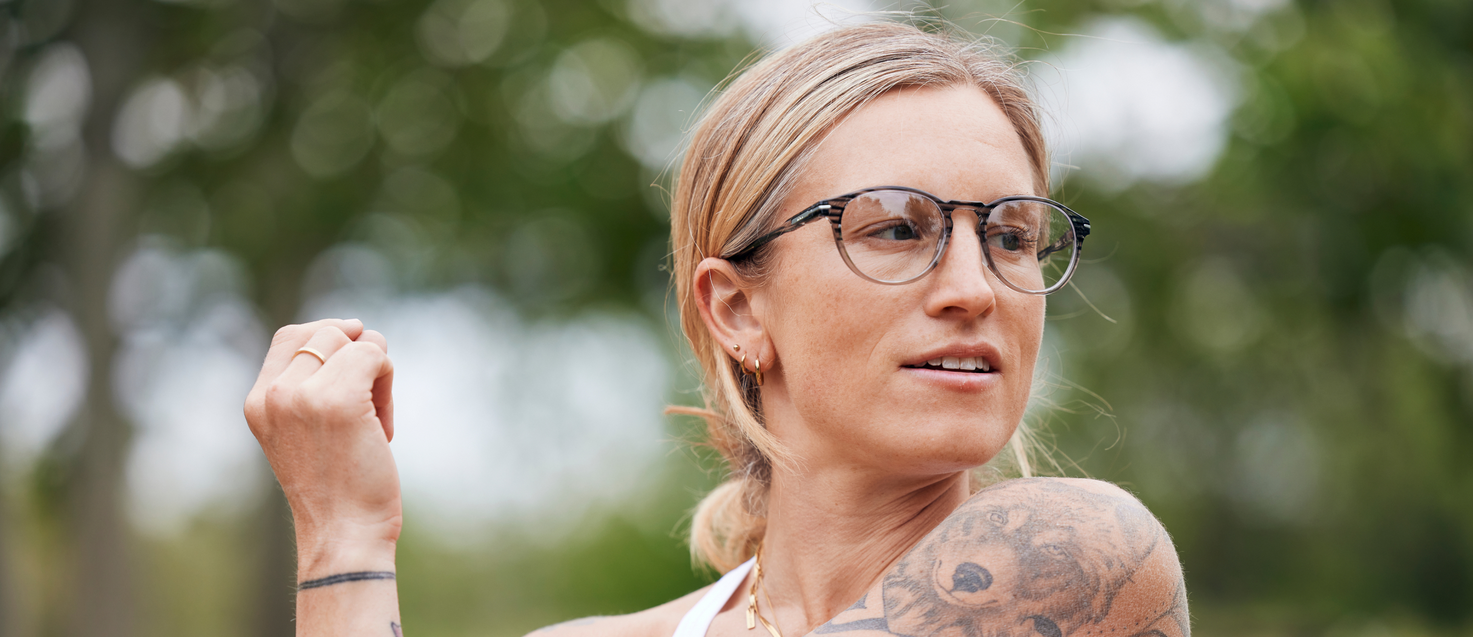 Woman stretching in Oslo eyeglasses