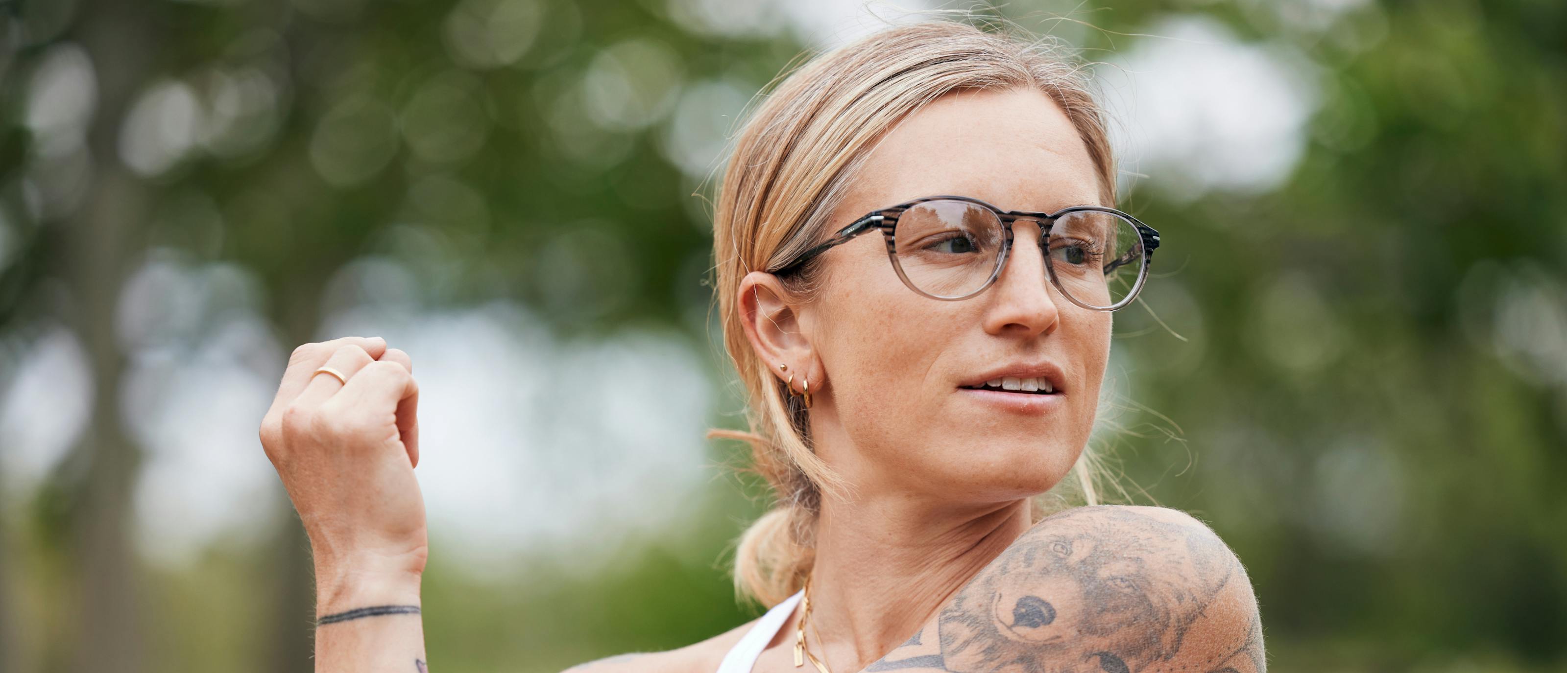 Woman stretching in Oslo eyeglasses