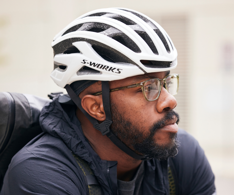 Man in cycling gear wearing Cade eyeglasses