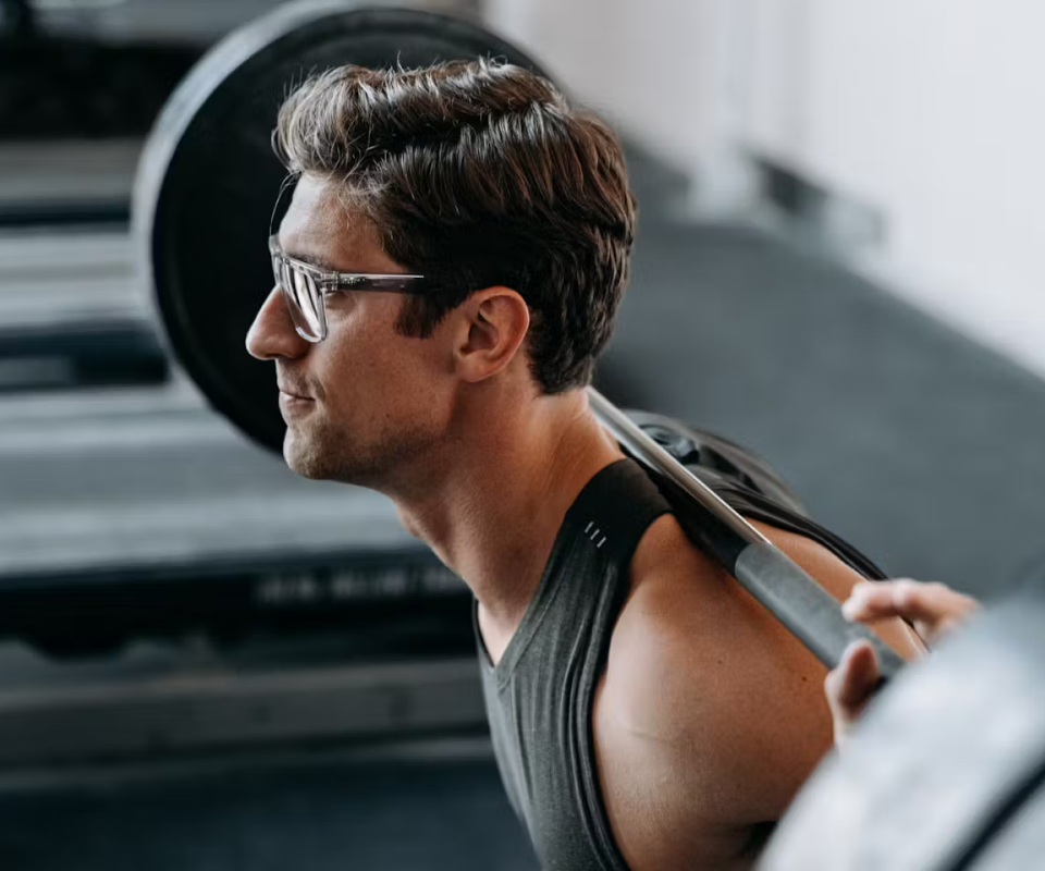 Man squatting in Barton eyeglasses