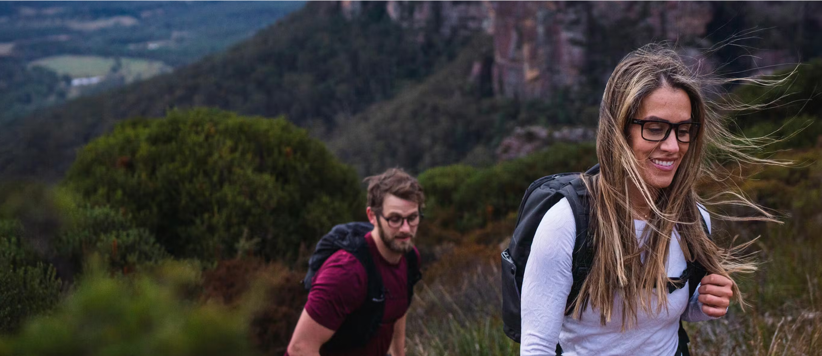 Man and woman hiking in woods