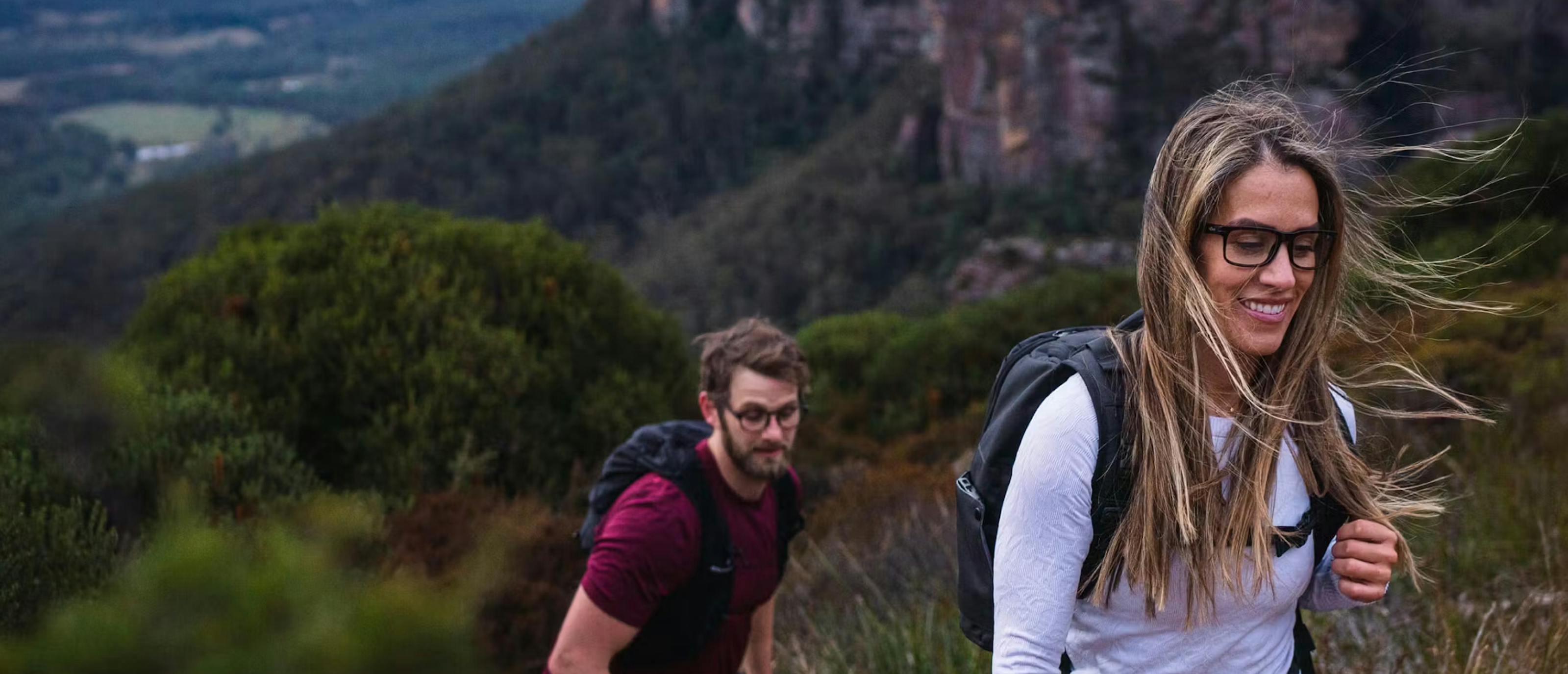 Man and woman hiking in woods