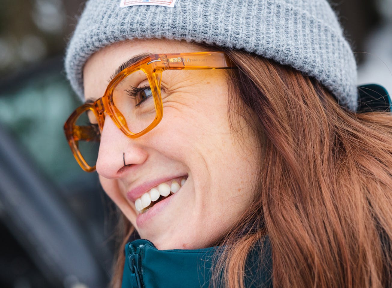 Woman wearing grey beanie and Lockhart eyeglasses