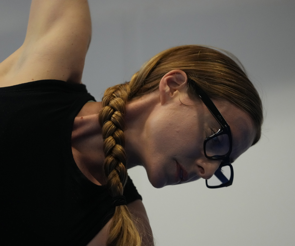 Woman doing yoga wearing Lockhart eyeglasses