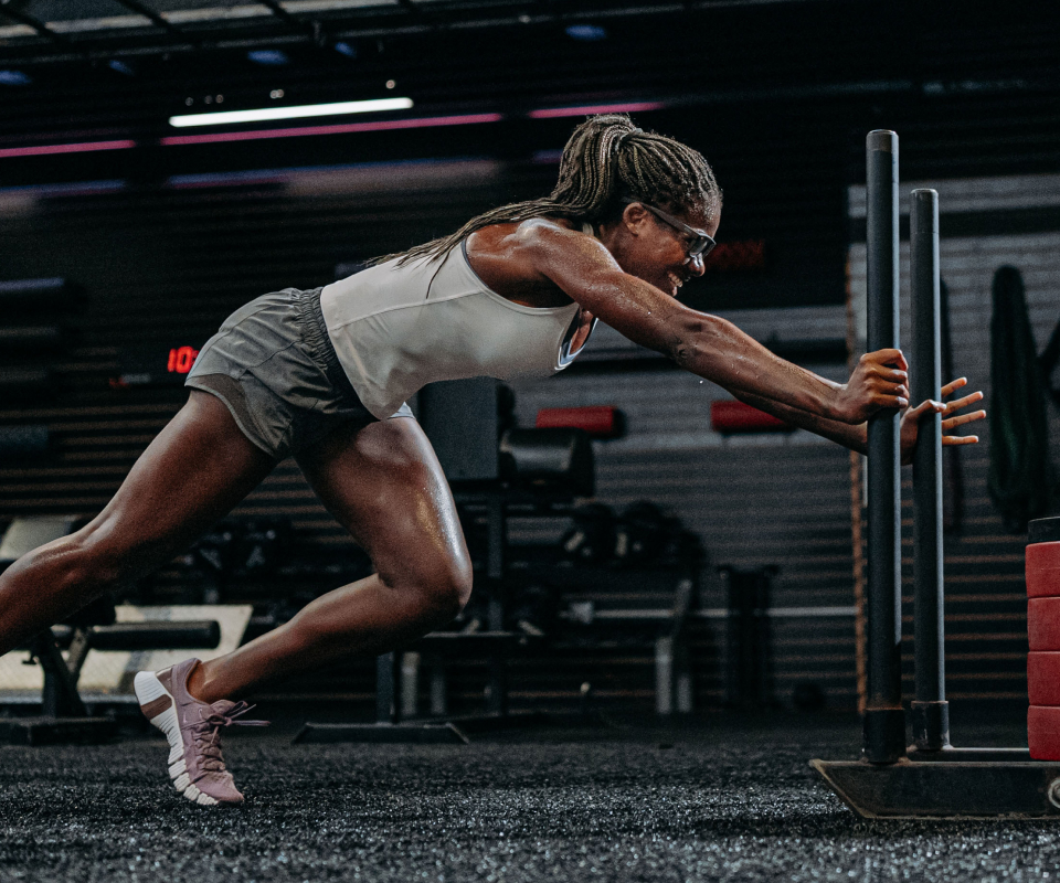 Woman pushing sled in Estacado eyeglasses