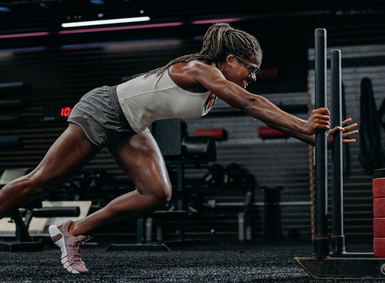 Woman pushing sled in Estacado eyeglasses