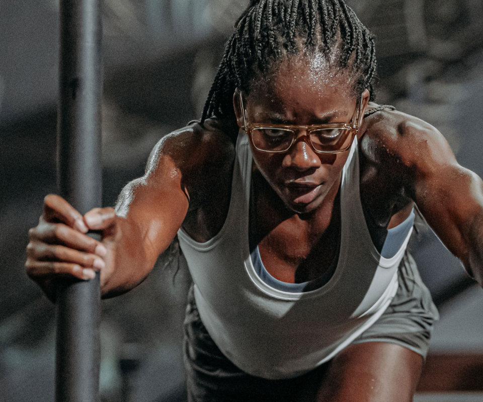 Woman pushing sled in Estacado eyeglasses