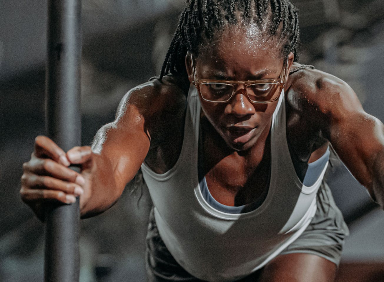 Woman pushing sled in Estacado eyeglasses