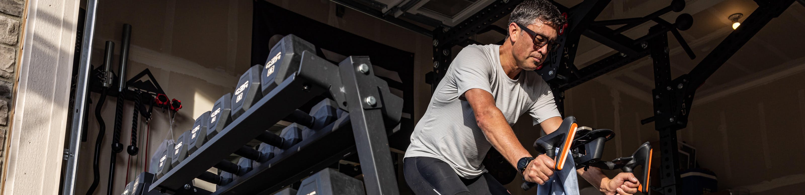 Man on stationary bike in Whistler eyeglasses