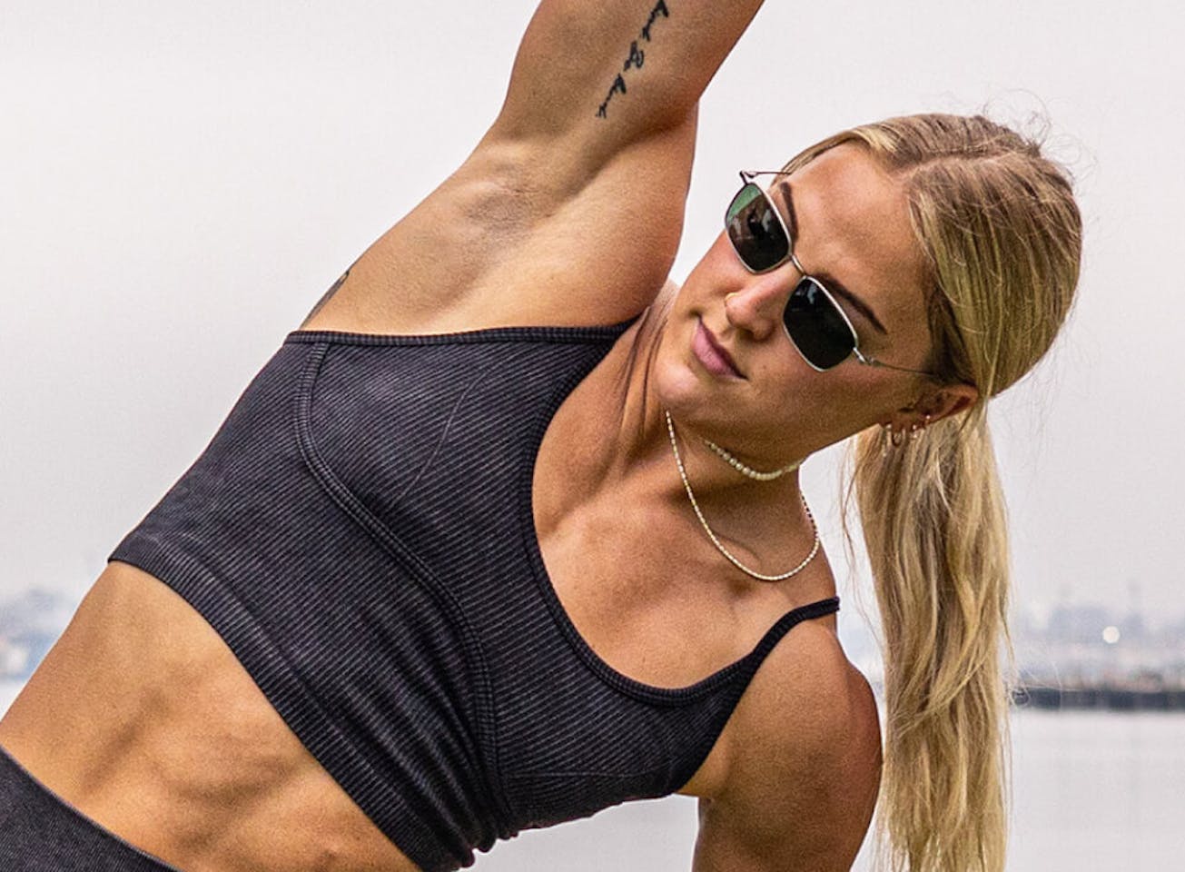 Woman stretching in Vapor sunglasses