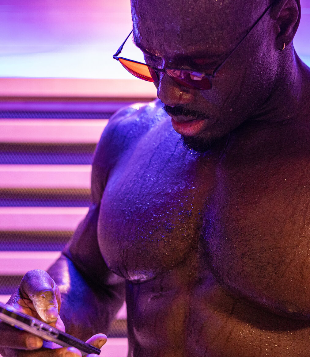 Man wearing vapor wind down glasses looking at phone