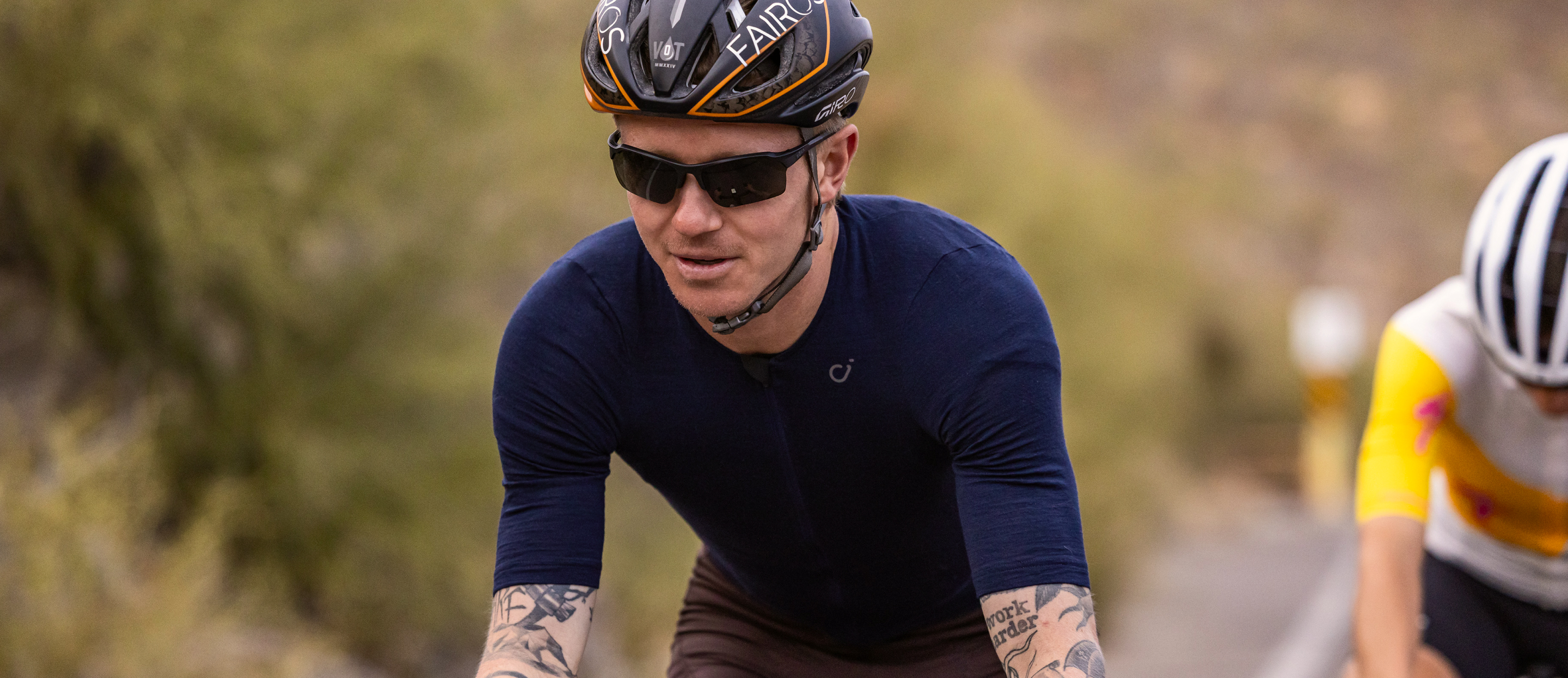 Man cycling wearing Tl-1 sunglasses