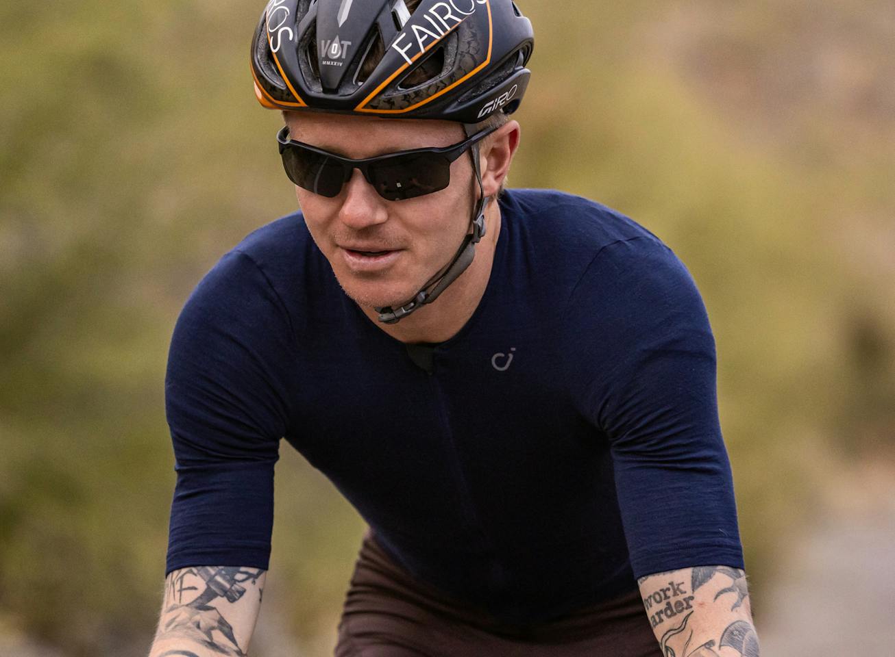 Man cycling wearing Tl-1 sunglasses