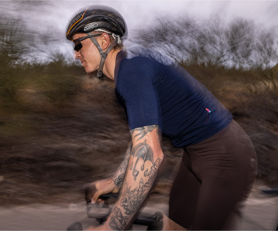 Man cycling wearing Tl-1 sunglasses