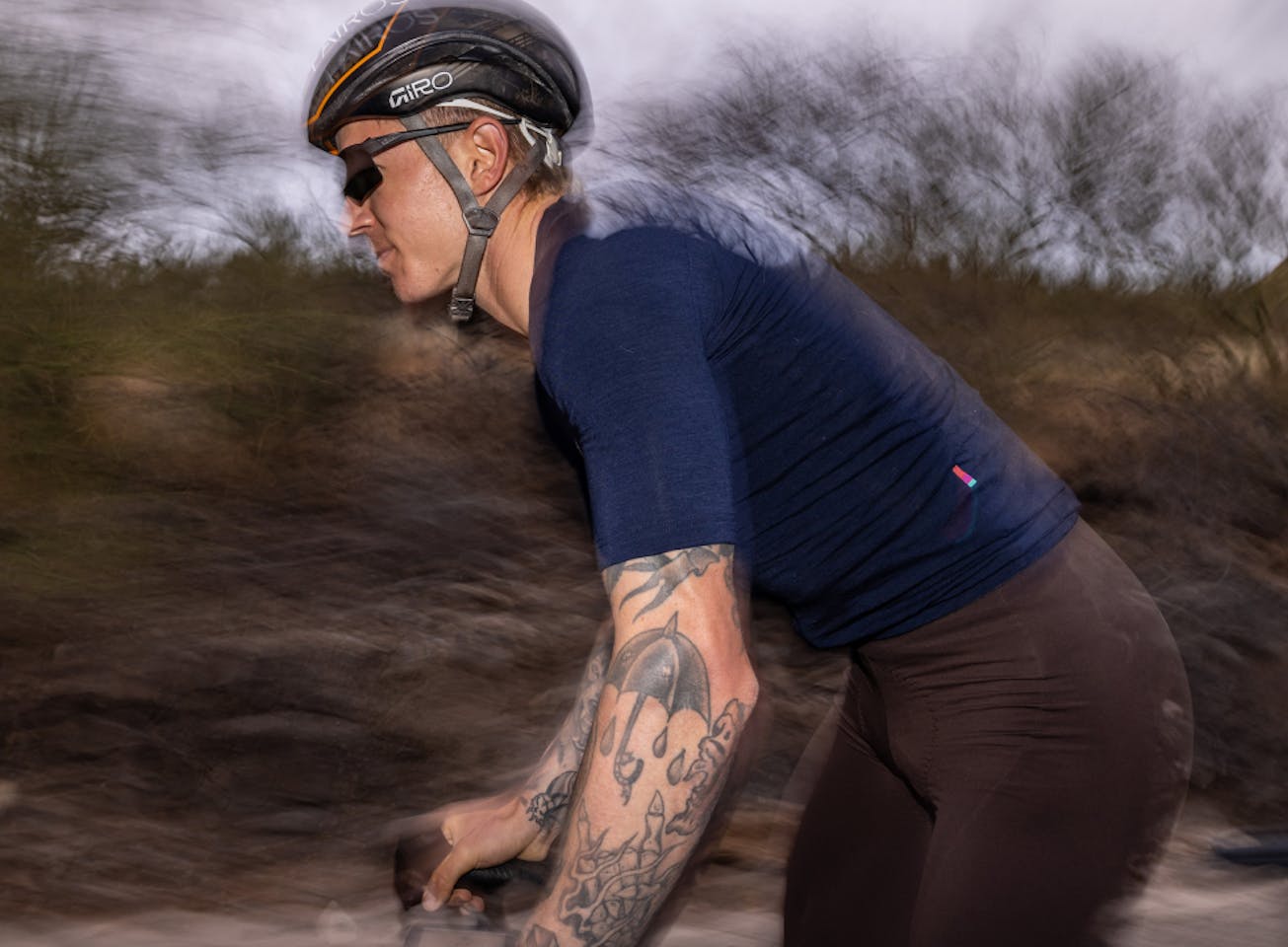 Man cycling wearing Tl-1 sunglasses