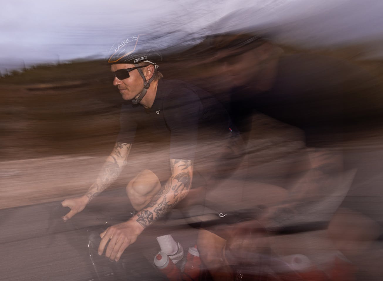 Man cycling wearing Tl-1 sunglasses