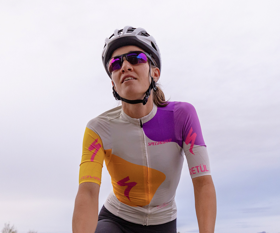 Woman cycling wearing TL-1 sunglasses