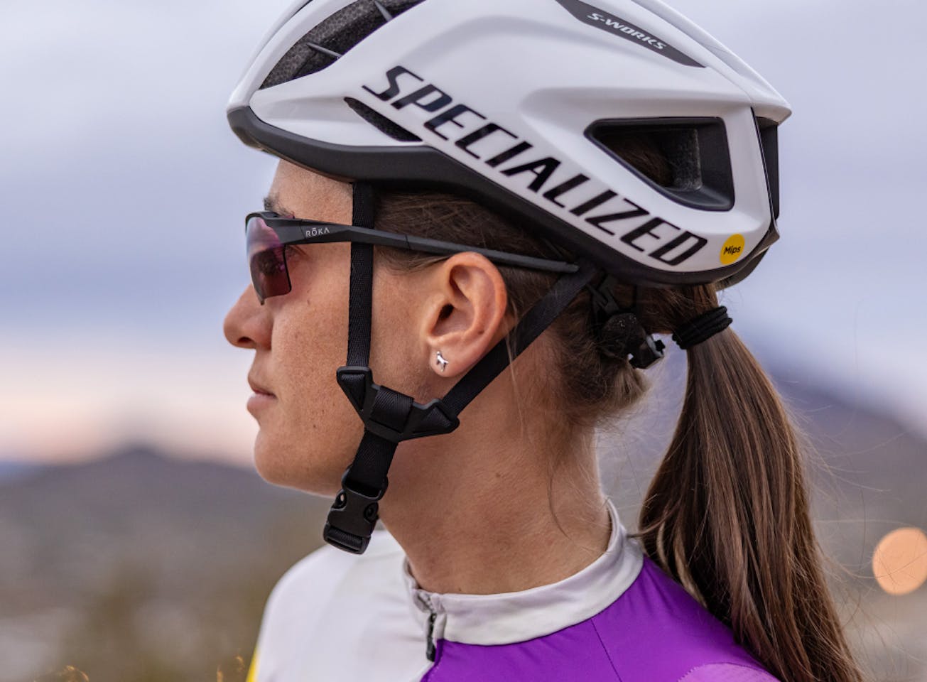 Woman wearing cycling helmet and TL-1 sunglasses