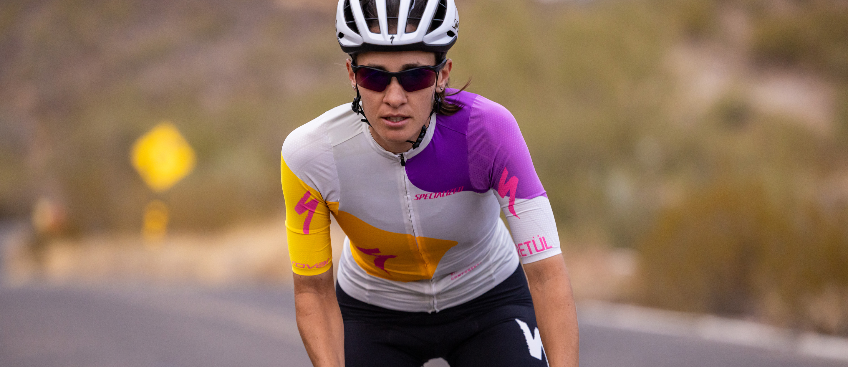 Woman cycling wearing TL-1 sunglasses