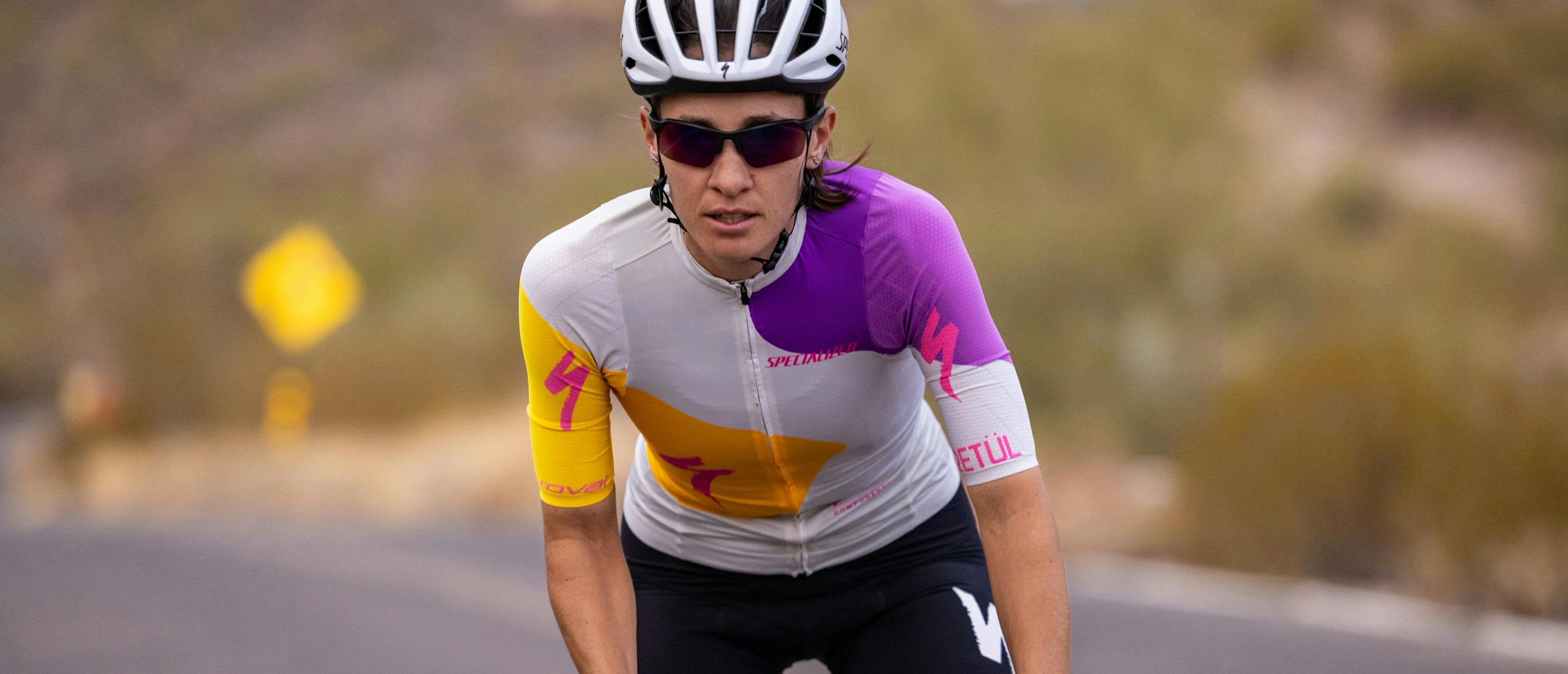 Woman cycling wearing TL-1 sunglasses