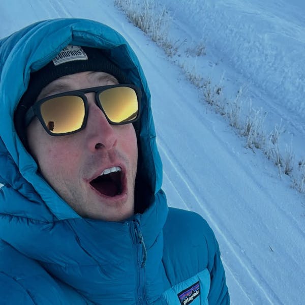 Man in snow wearing Estacado sunglasses