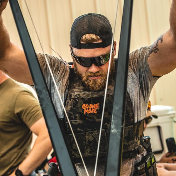 Man working out on skierg in ROKA sunglasses