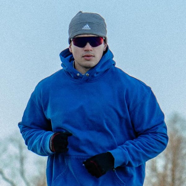 Man jogging in ROKA sunglasses