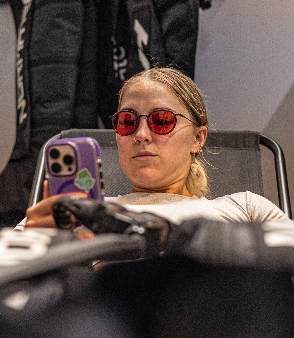 Woman wearing Alto Fusion glasses looking at phone