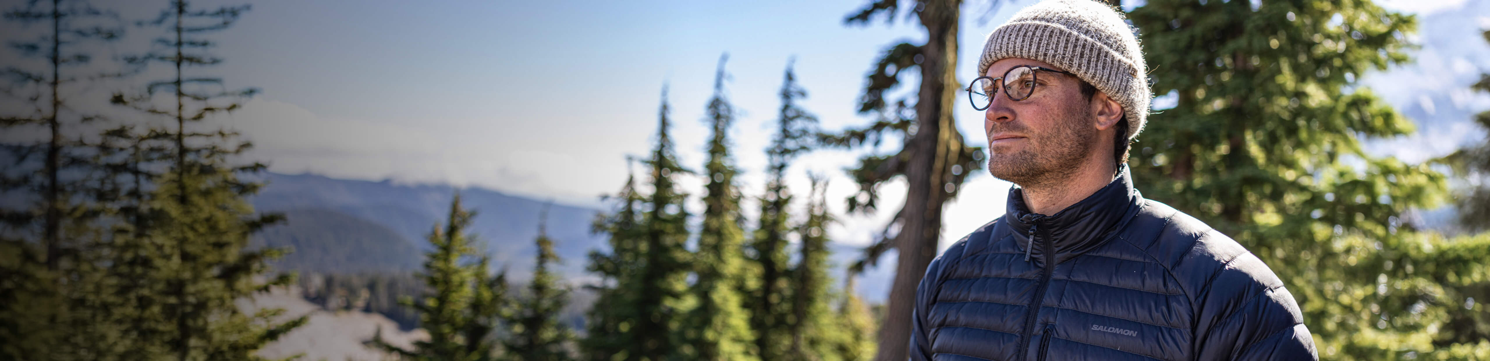 Man hiking in forest in Alto Fusion eyeglasses
