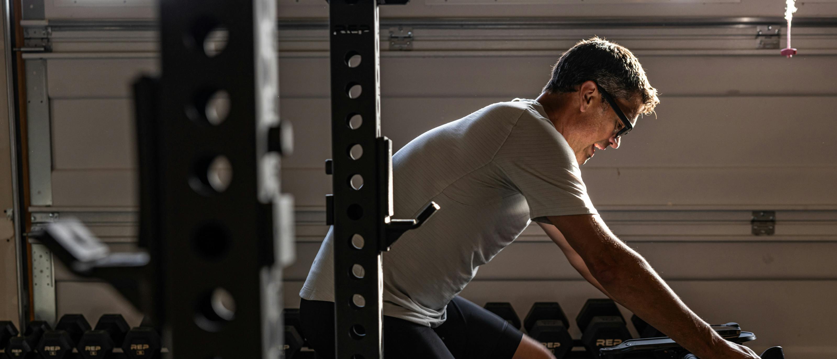 Man on stationary bike wearing Jackson eyeglasses