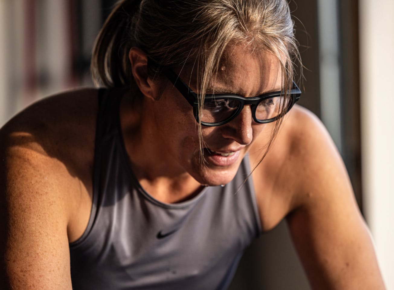 Woman wearing grey tank top and Jackson eyeglasses