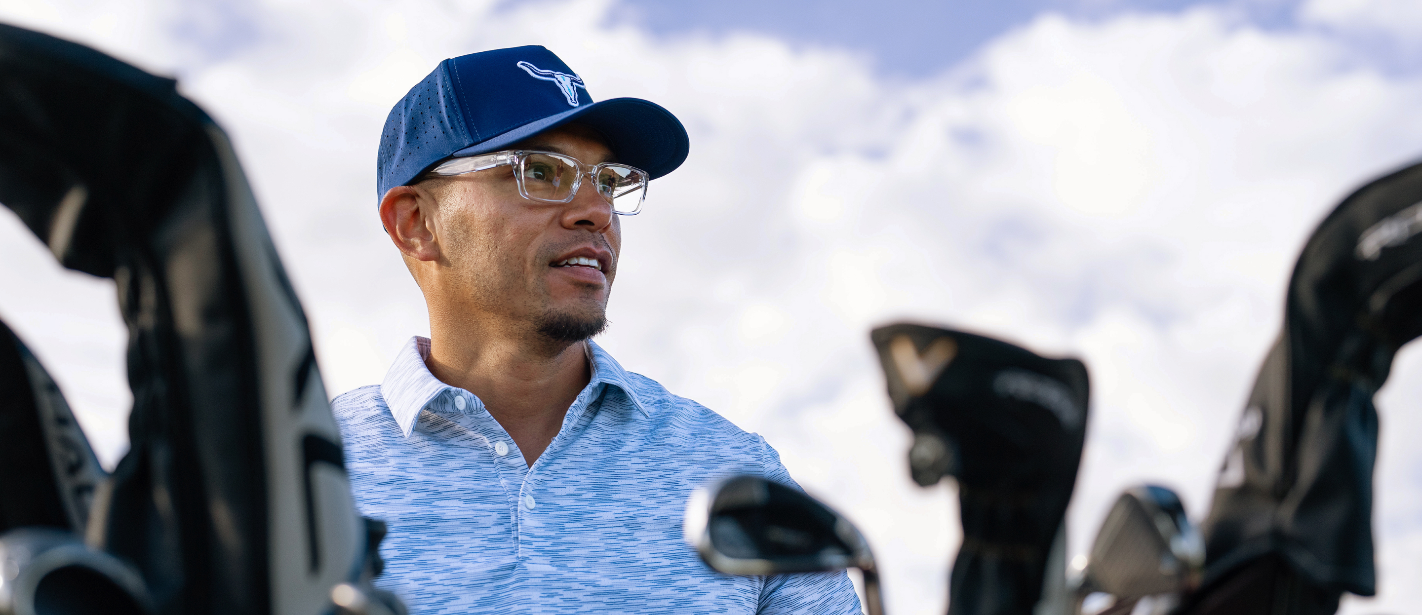 Man golfing in Mayfield eyeglasses