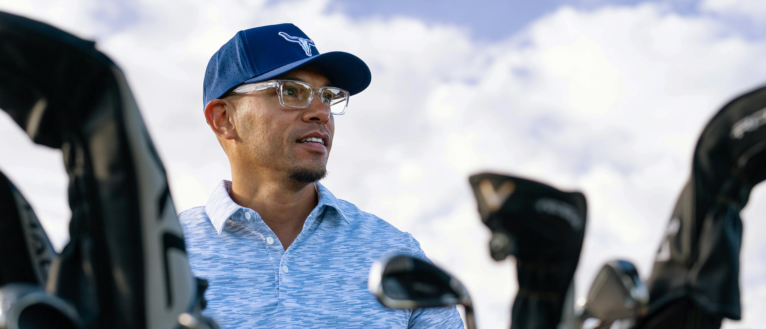 Man golfing in Mayfield eyeglasses