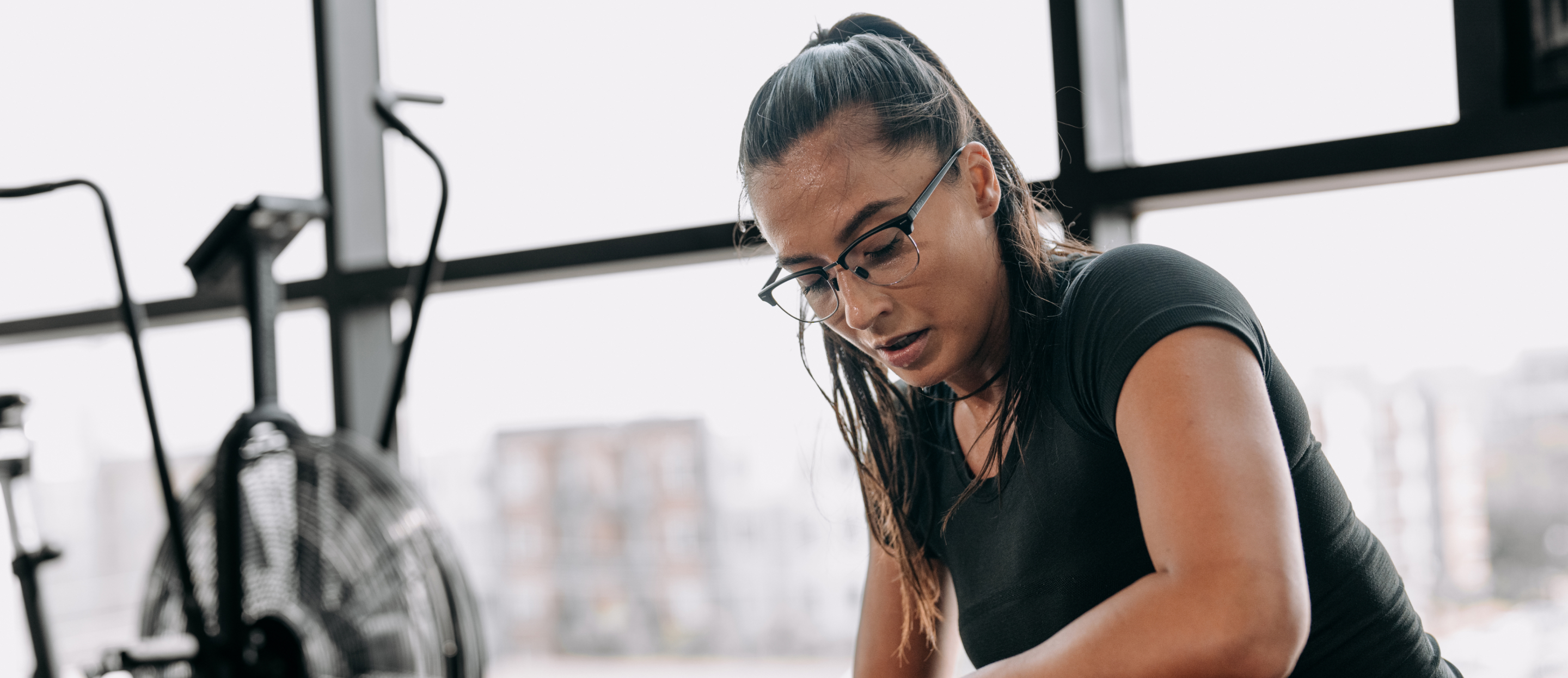 Woman in gym wearing Cambridge Eyeglasses