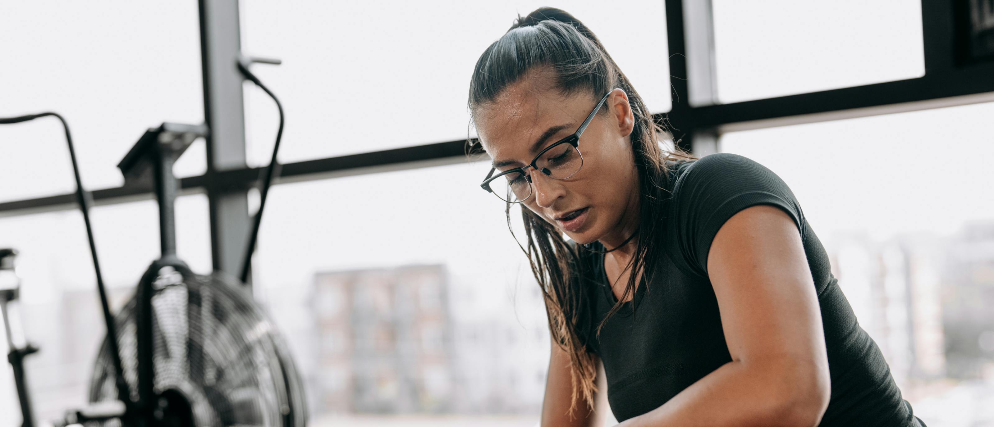 Woman in gym wearing Cambridge Eyeglasses