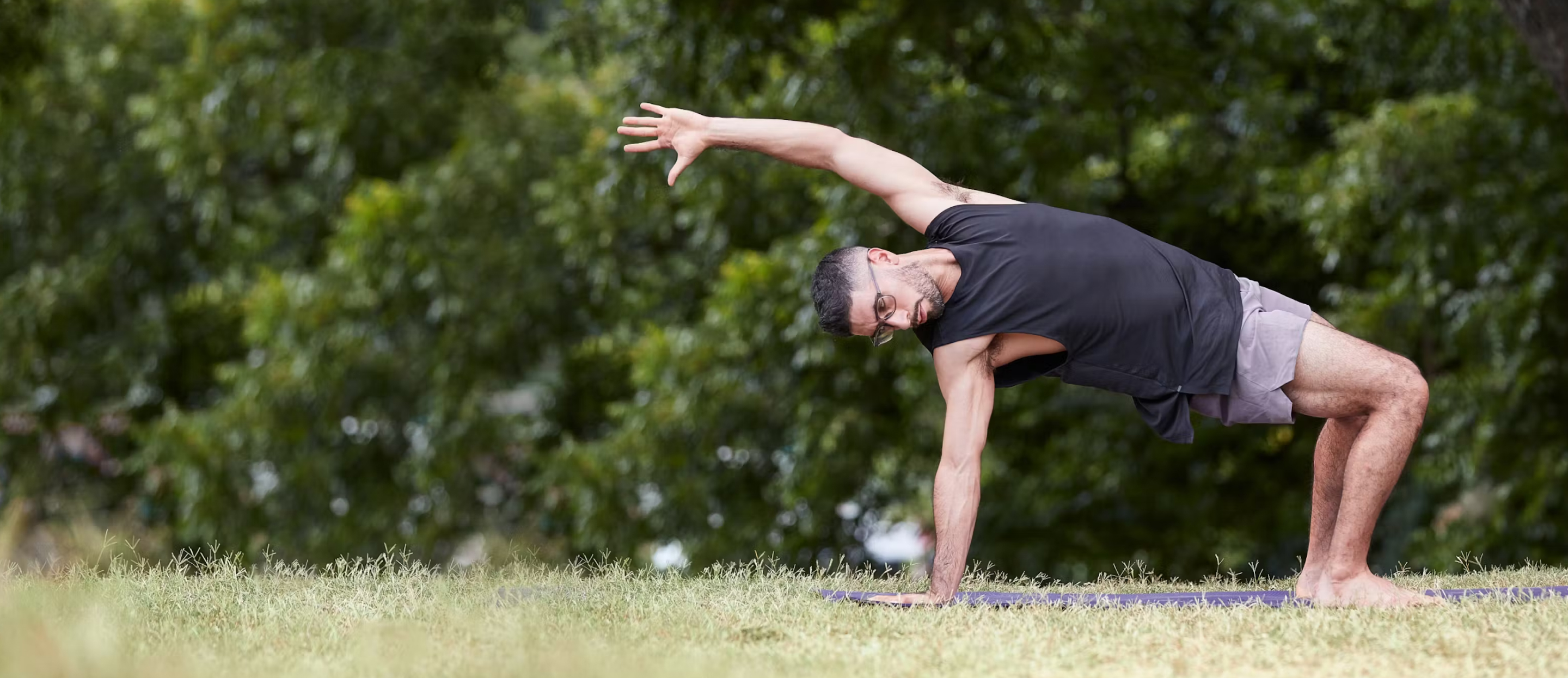 Man doing Yoga in Zilker eyeglasses