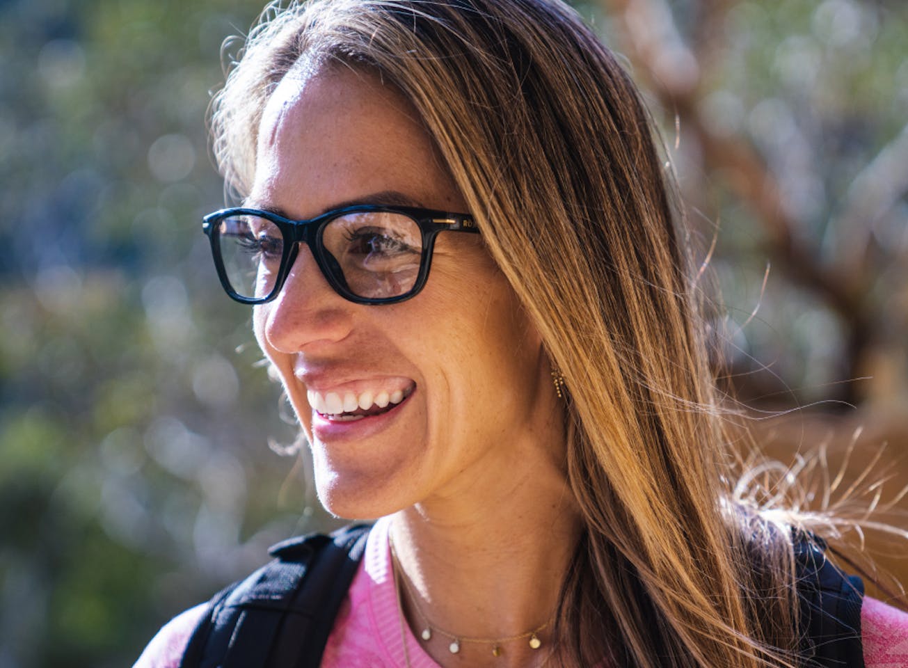 Woman smiling wearing Zilker eyeglasses