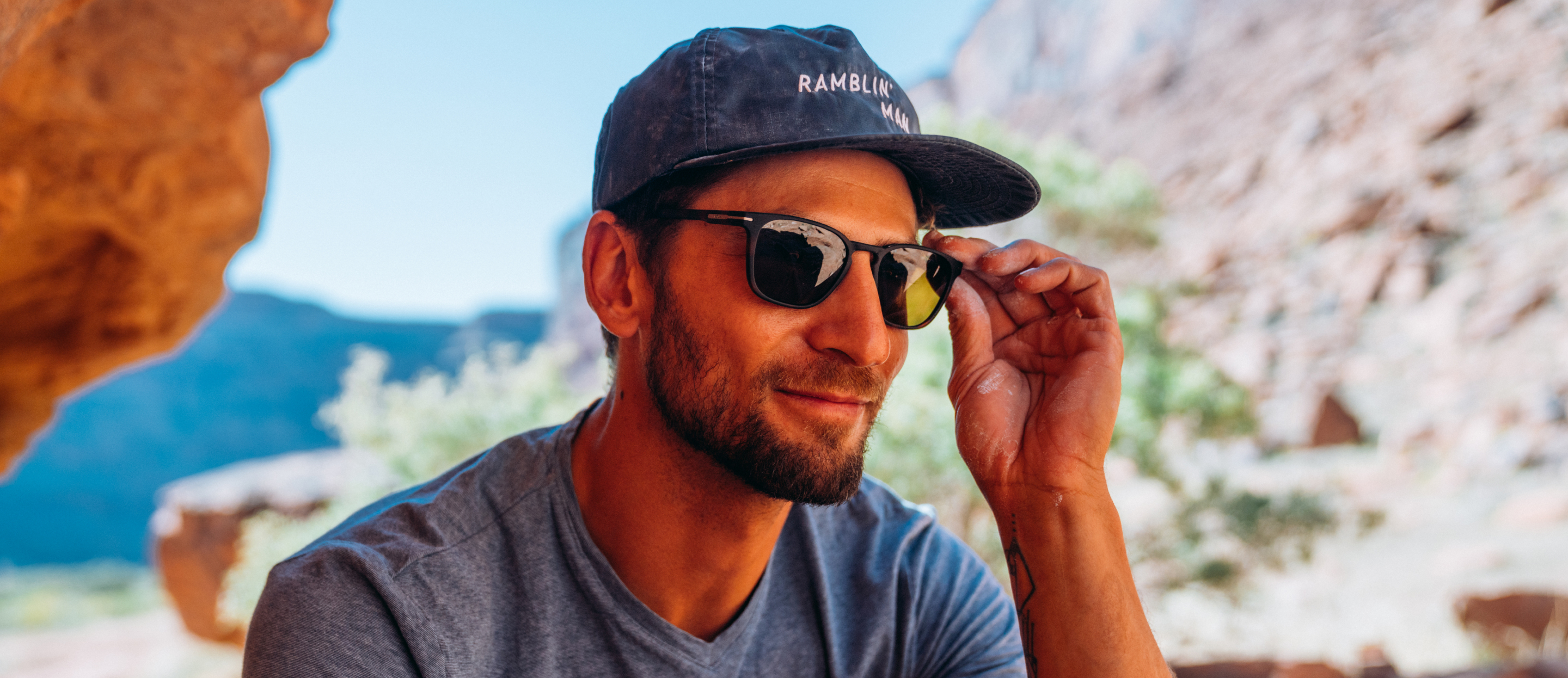 Man in rocky desert wearing Rory Sunglasses