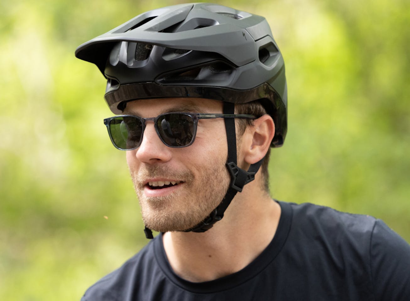 Man wearing bicycle helmet and Rory Sunglasses