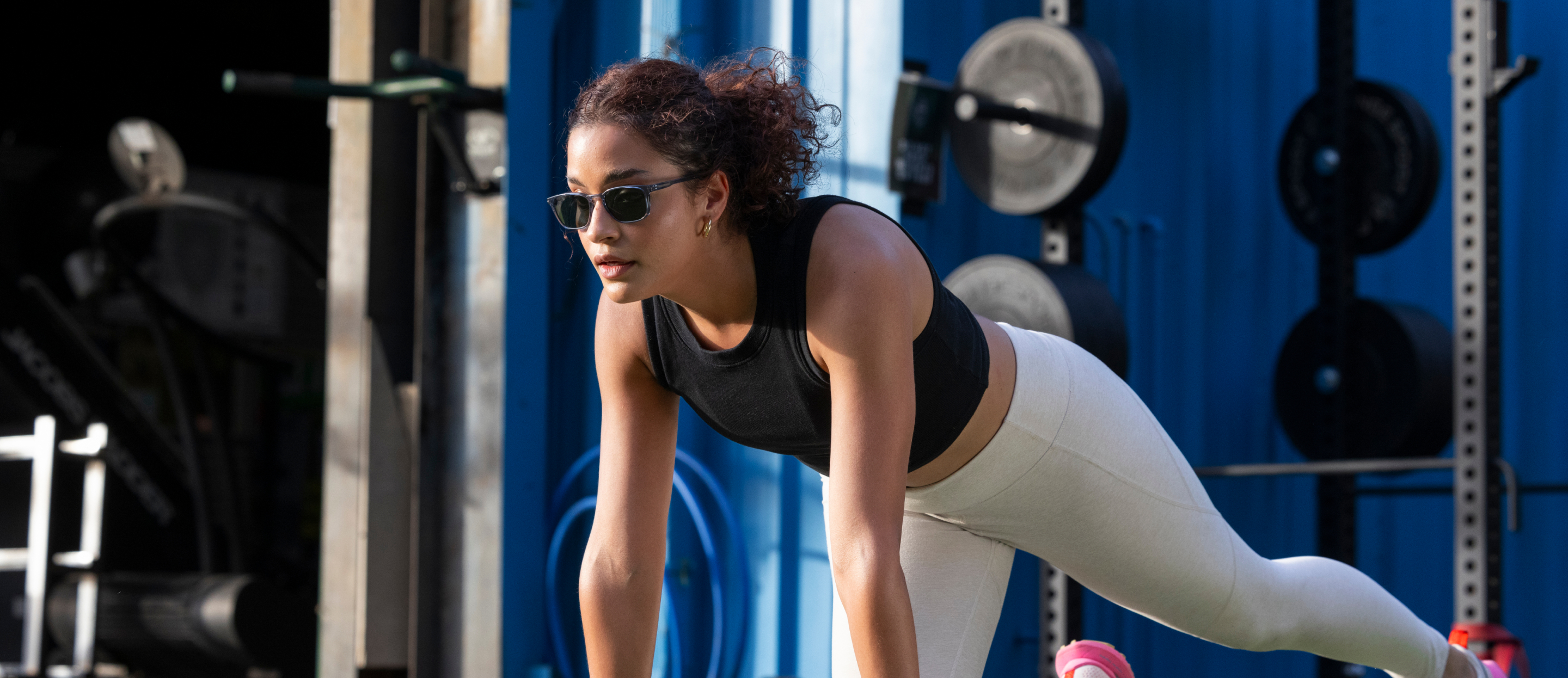 Woman planking wearing Cade Sunglasses