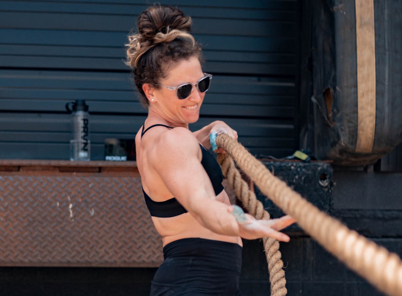 Woman pulling rope wearing Hunter sunglasses