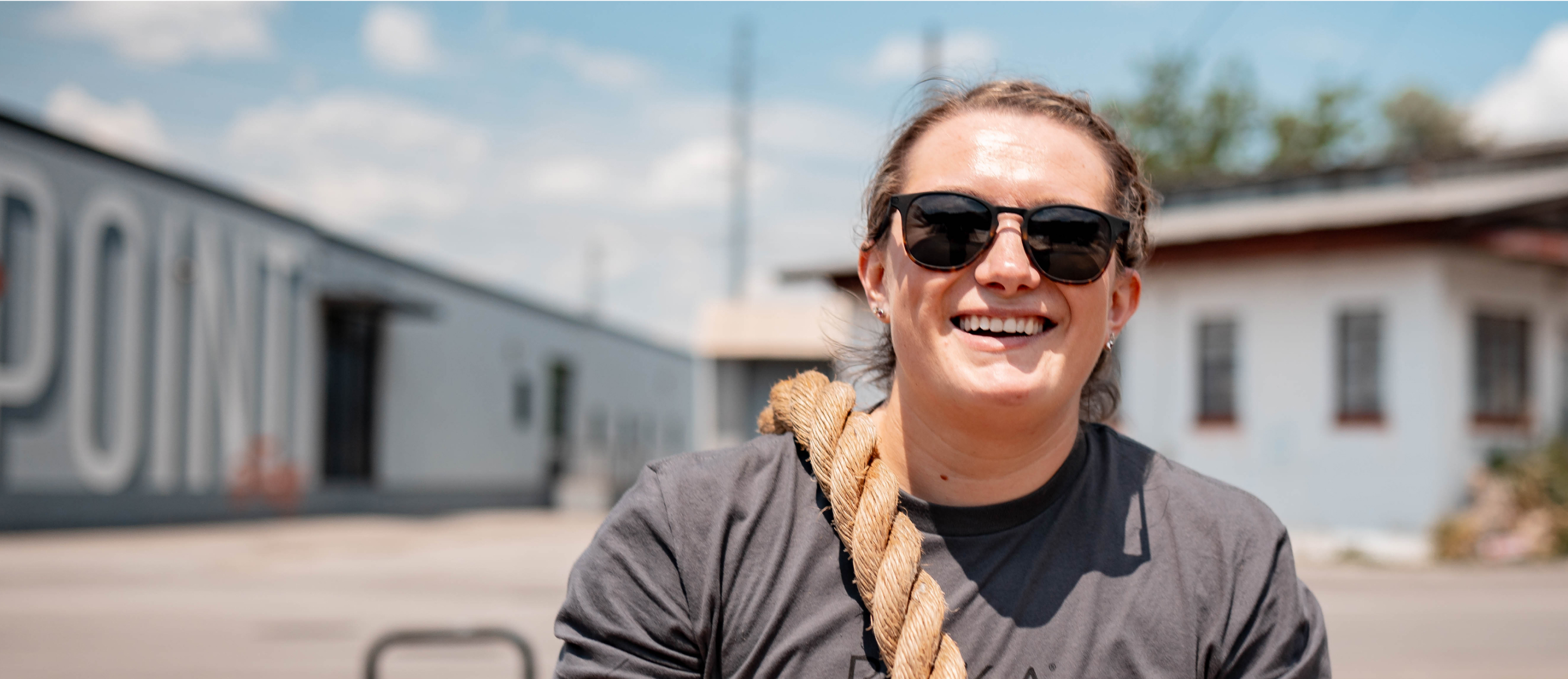 Woman carrying rope in Hunter sunglasses