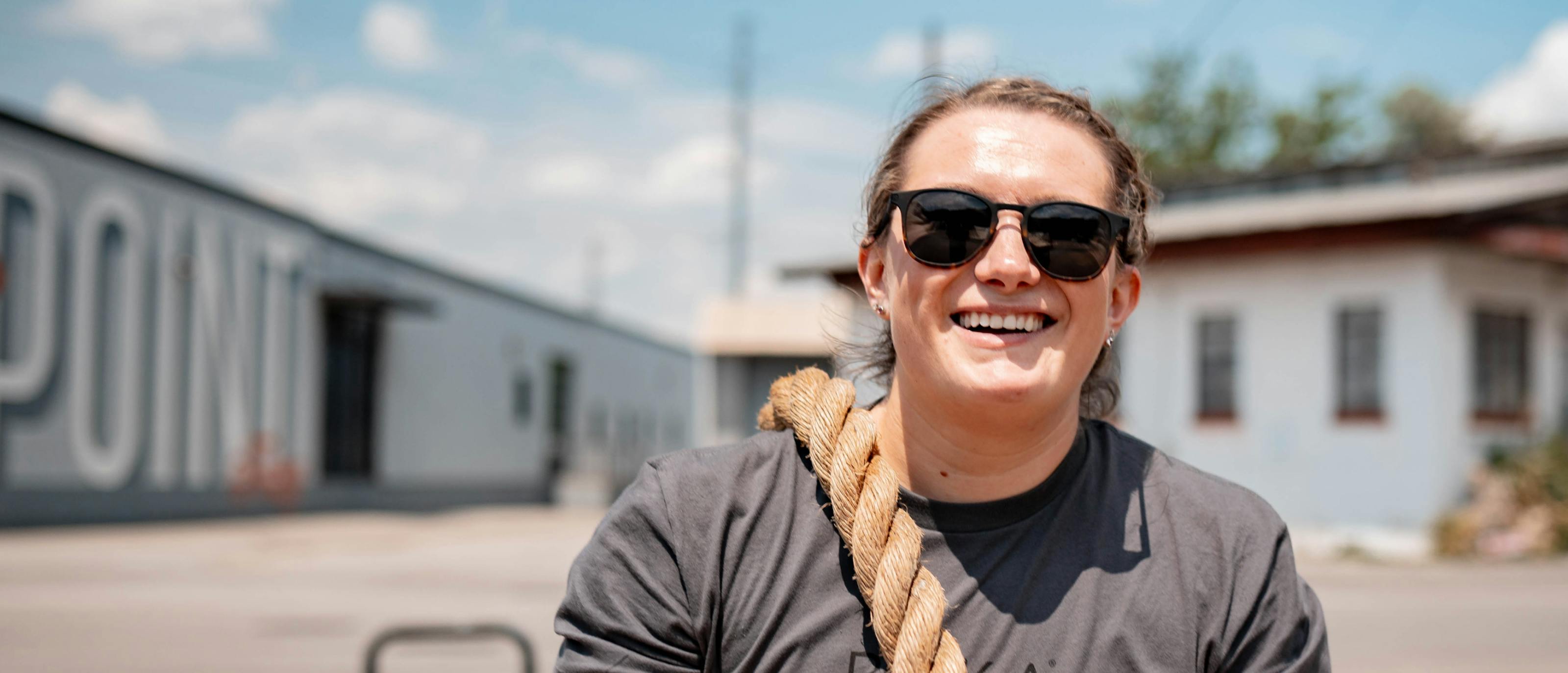 Woman carrying rope in Hunter sunglasses