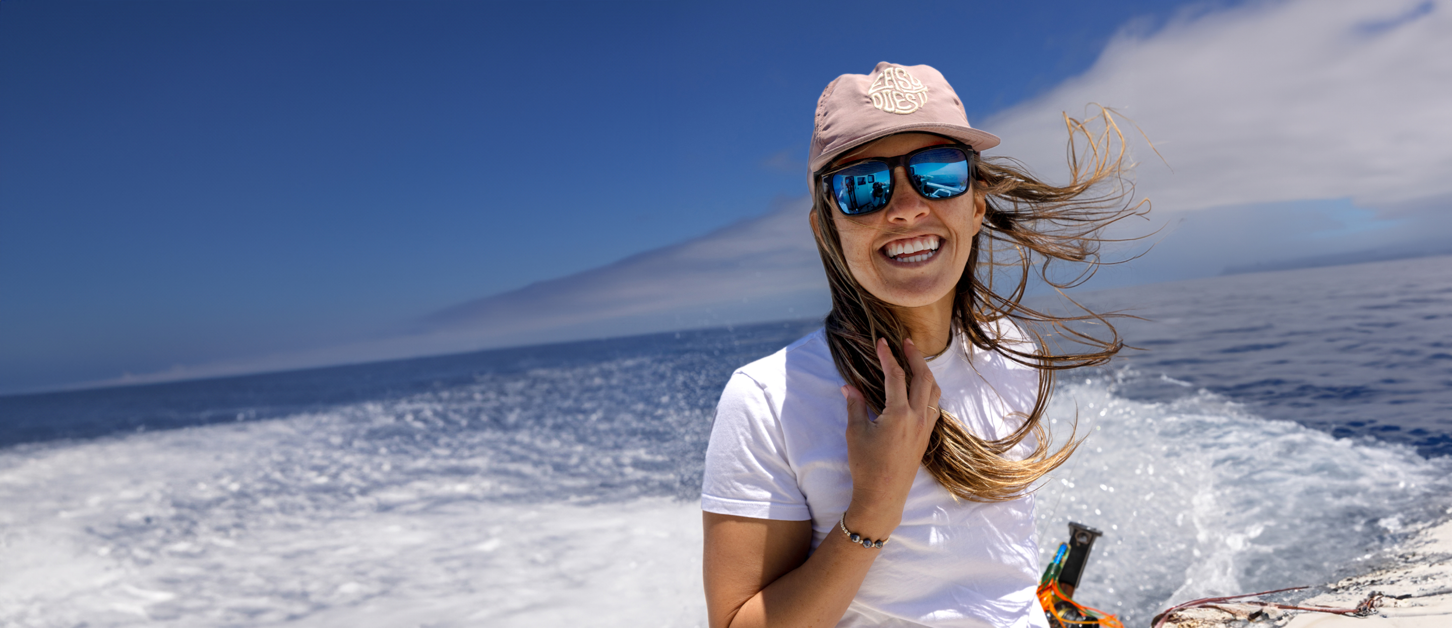 Woman on boat in the ocean wearing Barton sunglasses