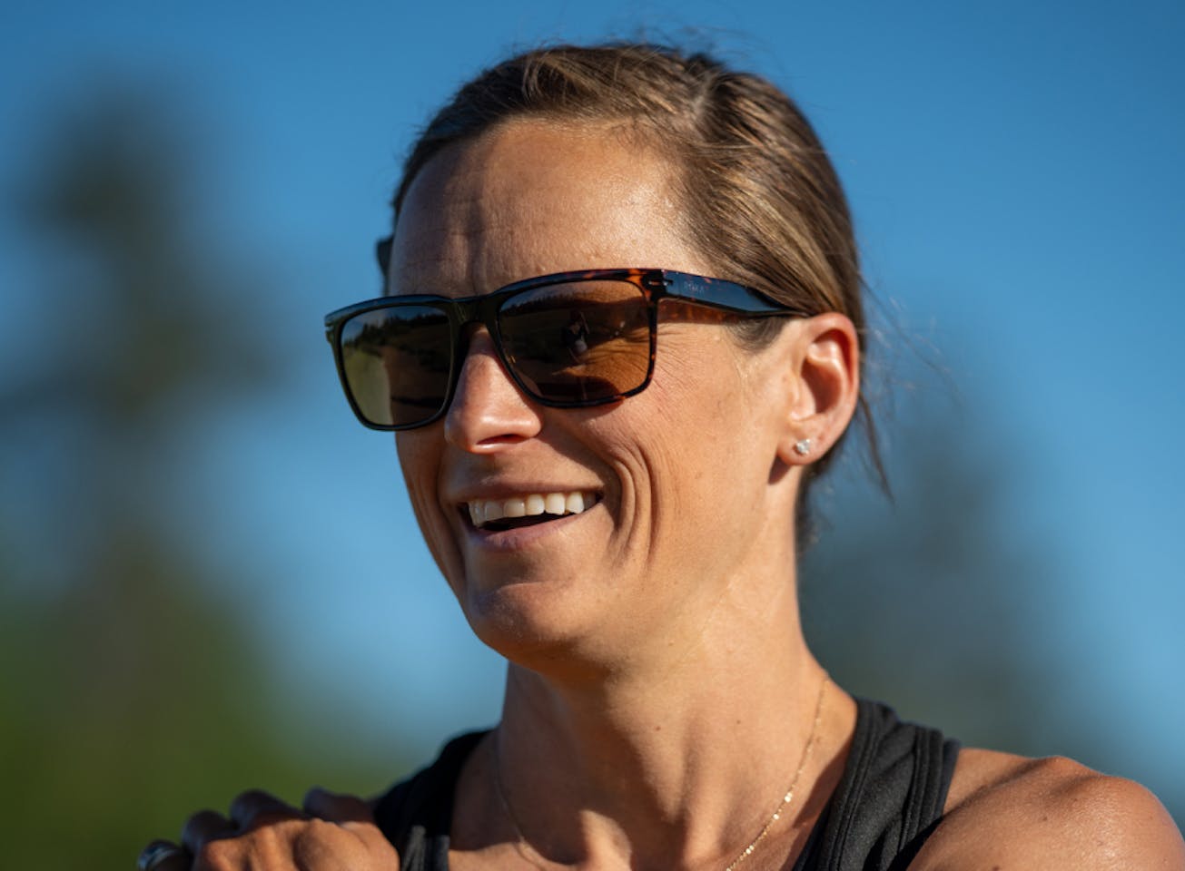 Woman smiling wearing Barton sunglasses