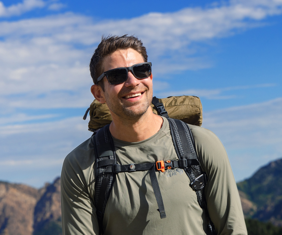 Man hiking in Braker 2.0 sunglasses