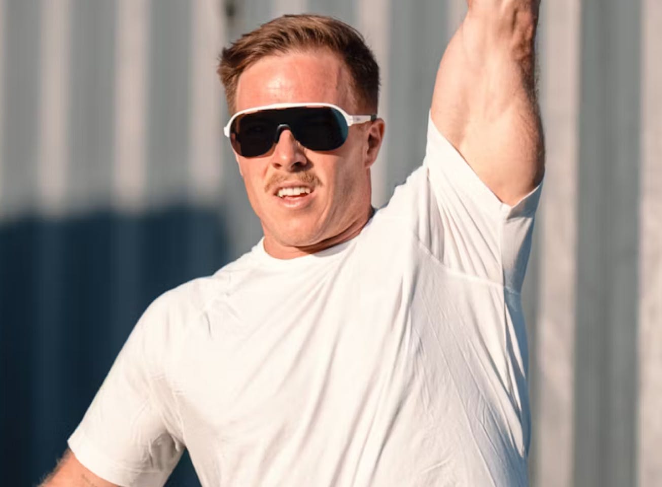 Man lifting weight wearing San Remo Air sunglasses