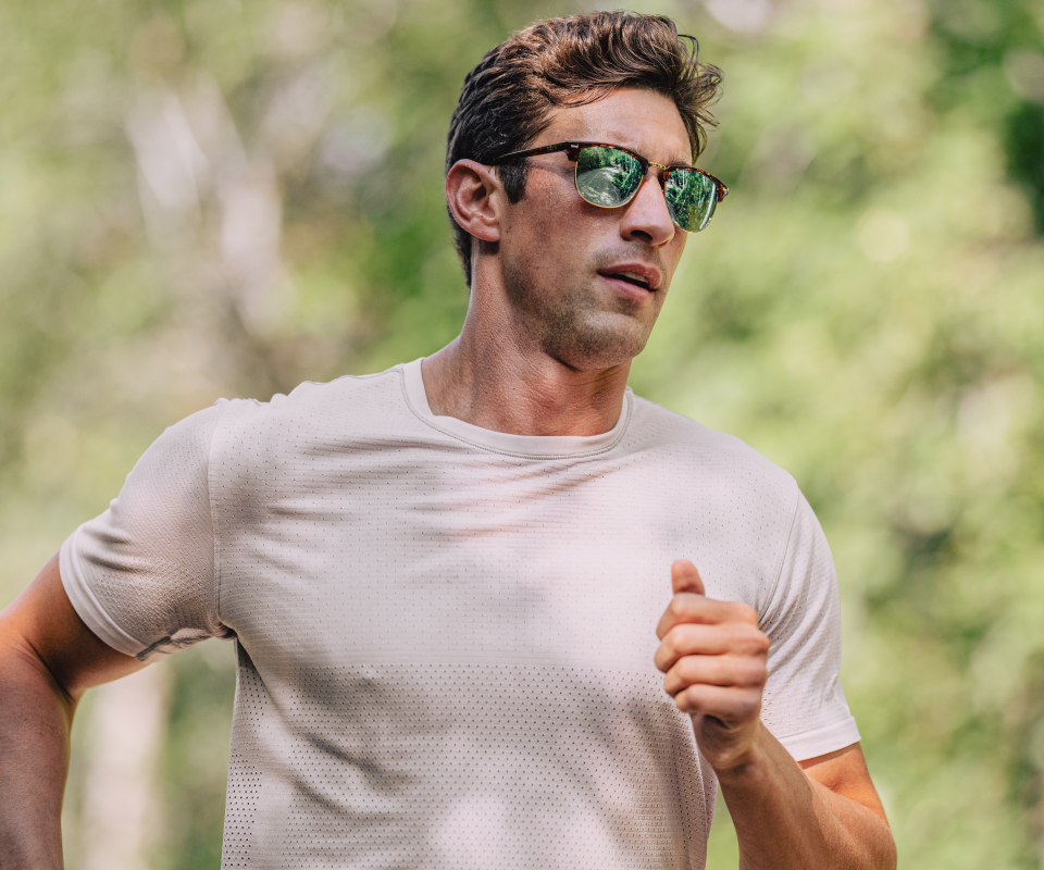Man jogging in Cambridge sunglasses