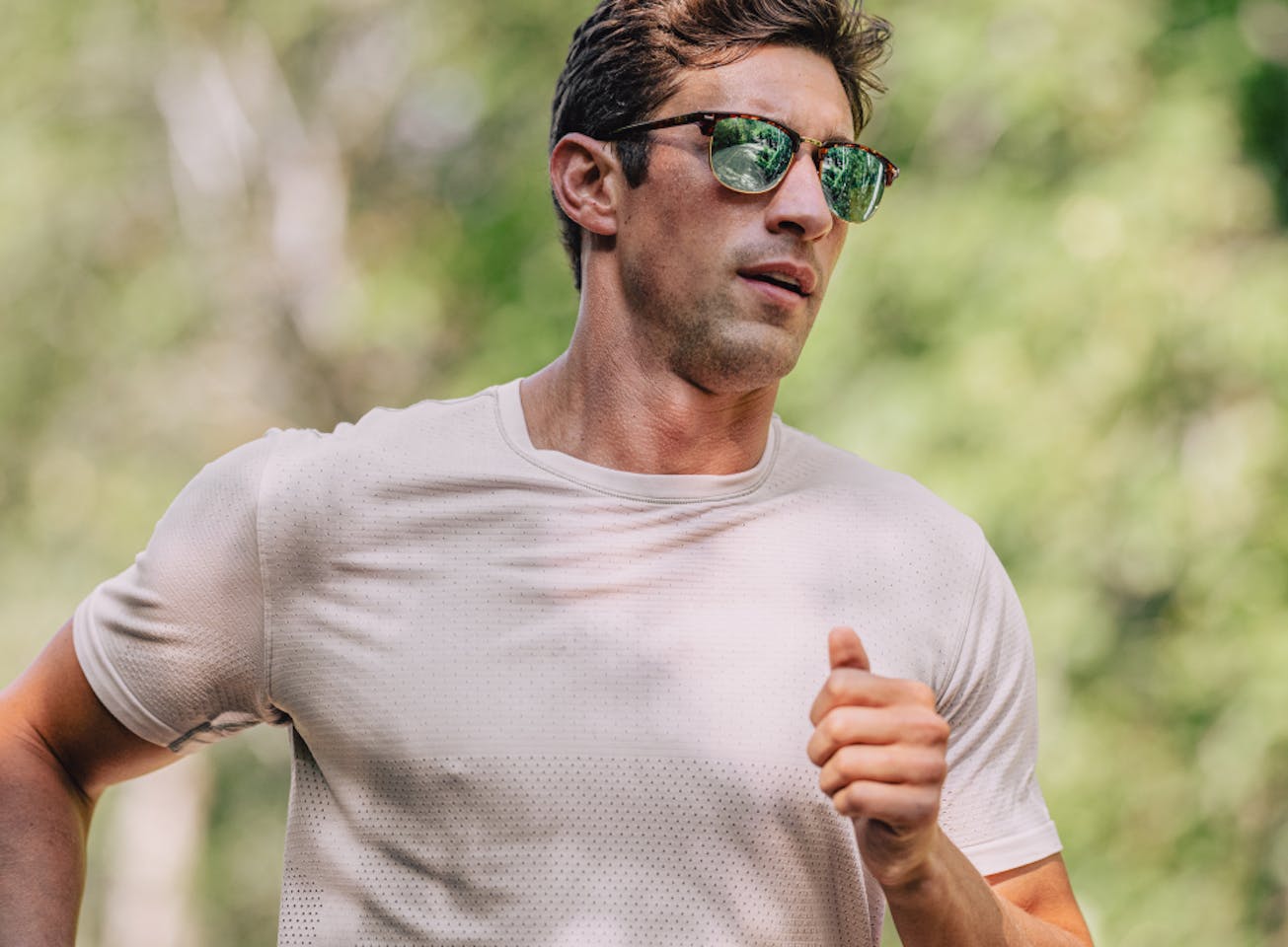 Man jogging in Cambridge sunglasses